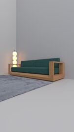 Modern executive lounge sofa with a thick solid oak frame and charcoal grey cushions shown from a perspective angle.