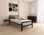 Minimalist single black metal bed frame with a sturdy headboard and matte finish for modern Egyptian homes.