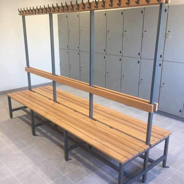 "Professional double-sided locker room bench with natural wood slats, central backrest, and integrated coat hooks on a grey metal frame."