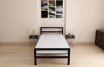 Minimalist single black metal bed frame with a sturdy headboard and matte finish for modern Egyptian homes.
