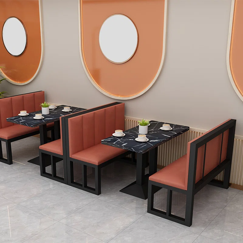 Modern industrial cafe sofa with a black electrostatically-coated steel frame, grey upholstered cushions, and a reinforced minimalist metal chassis for restaurant seating.