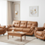 Premium tan leather office sofa set with a three-seater couch and two armchairs for executive reception areas and corporate institutions.