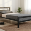 Minimalist single black metal bed frame with a sturdy headboard and matte finish for modern Egyptian homes.