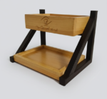 Industrial two-tier food display stand with black metal frame and wooden trays for restaurant table service and café branding.