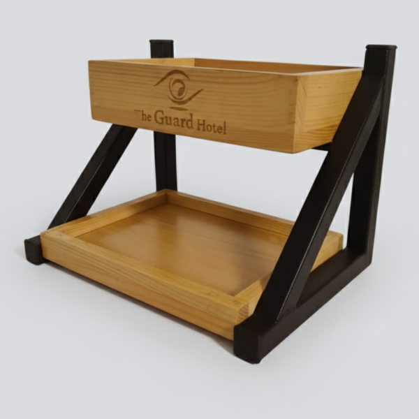 Industrial two-tier food display stand with black metal frame and wooden trays for restaurant table service and café branding.