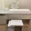 Modern all-wood white executive office desk with L-shape side cabinet and matching coffee table for manager offices.