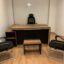 Premium walnut and black executive wooden desk with L-shaped side cabinet and matching coffee table by Quality Furniture.
